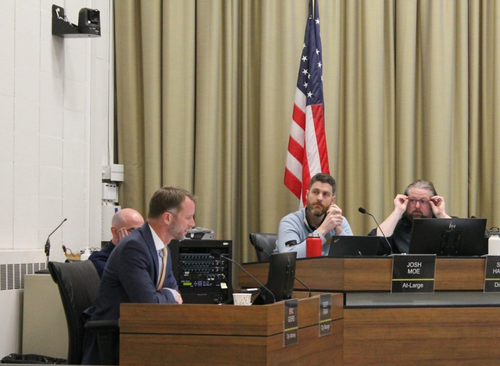 Iowa City attorney Eric Goers (left), speaks to the council at its March 19 meeting.