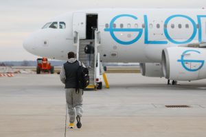 Athletic Trainer for Iowa Men's Basketball Brad Floy boards a chartered airplane at the Eastern Iowa Airport on Wednesday, Feb. 7, 2024. student athletes