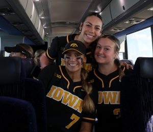 Iowa Hawkeyes utility player Sammy Diaz (bottom left), outfielder Tatianna Roman (above) and pitcher Devyn Greer (bottom right) on the bus headed toward their game in the NFCA Leadoff Classic at the Eddie C. Moore Complex in Clearwater, Florida, on Saturday, Feb. 10, 2024. CREDIT JEROD RINGWALD/ UI ATHLETICS