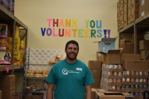 Executive director Ryan Bobst in the warehouse portion of the pantry. 