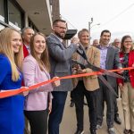 Members of Cedar Point Capital Partners held a ribbon cutting for the office space along with Ambassadors from the Cedar Rapids Metro Economic Alliance.