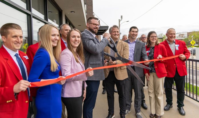 Members of Cedar Point Capital Partners held a ribbon cutting for the office space along with Ambassadors from the Cedar Rapids Metro Economic Alliance.