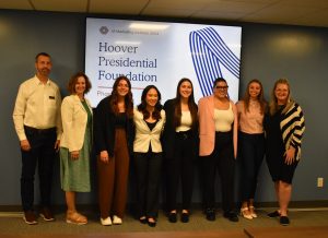 Marketing Institute students pose with members of the Herbert Hoover Foundation (pictured right): David Ansele, assistant director of marketing and communications; Mundy McCarty, president and CEO; Marisa Vasilevich, Sarah Phan, Anna McDonald, Caroline Peavey, Grayson Kilburn, director of executive development, will be appointed by Shelley Mott. 