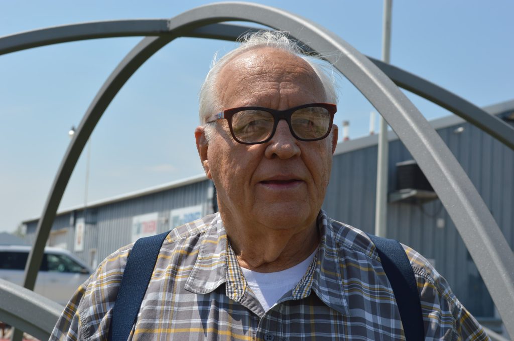 Tom Barnes stands outside of Barnes Manufacturing in Marion next to the entrance arch that will be installed in Shakespeare Garden in Cedar Rapids. CREDIT CINDY HADISH