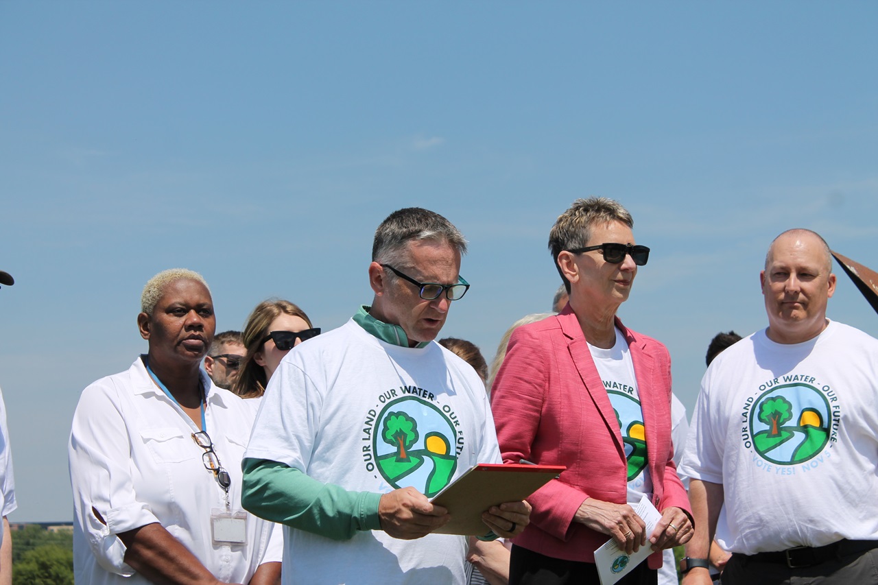 Johnson County Board of Supervisors with the Johnson County Conservation Board are joined by new committee "Our Land. Our Water. Our Future.," co-chaired by THINK Iowa City president Josh Schamberger (left) and former Johnson County supervisor Pat Heiden (right) on Wednesday at Riverfront Crossings Park.