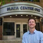 Jordan Immerfall, founder of GoldCap Education and program administrator and instructor at the UI College of Education, poses at the Ped Mall in downtown Iowa City on May 7.