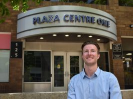 Jordan Immerfall, founder of GoldCap Education and program administrator and instructor at the UI College of Education, poses at the Ped Mall in downtown Iowa City on May 7.