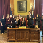 Gov. Kim Reynolds signs Iowa HF2667 into law, which expands Iowa’s tax deduction for 529 and ABLE savings accounts and allows rollovers from Iowa’s 529 account to a Roth IRA. CREDIT IOWA TREASURER ROBY SMITH