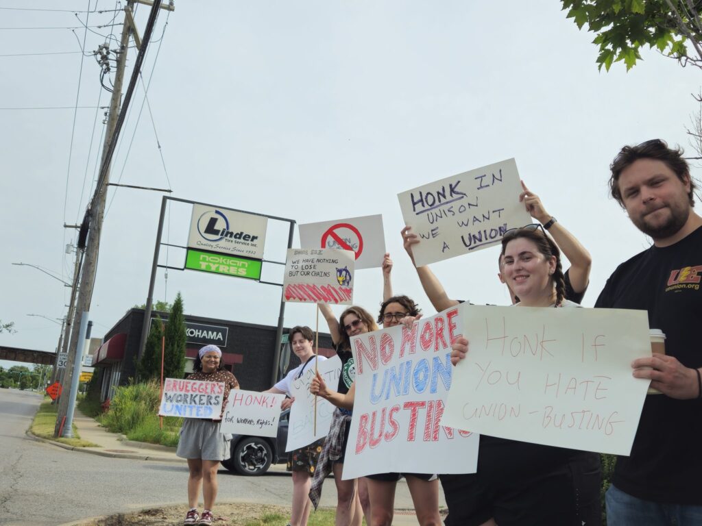 Bruegger's Bagels employees picket outside the franchise's South Riverside Drive location on June 15, 2024, in Iowa City. union
