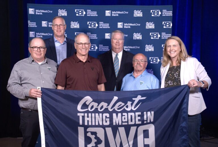Vermeer Corporation team members pose with their Coolest Thing Made in Iowa trophy during the Iowa Association of Business & Industry (ABI) annual conference in Davenport. Front row, from left, are: Vermeer team members: Kent Thompson, R&D senior engineering manager; Stan Fynaardt, assembler III; Terry Patterson, assembler II; and Mindi Vanden Bosch, vice president of operations. Back row, from left, are: MidWestOne CEO Chip Reese and ABI President Mike Ralston. CREDIT IOWA ASSOCIATION OF BUSINESS & INDUSTRY