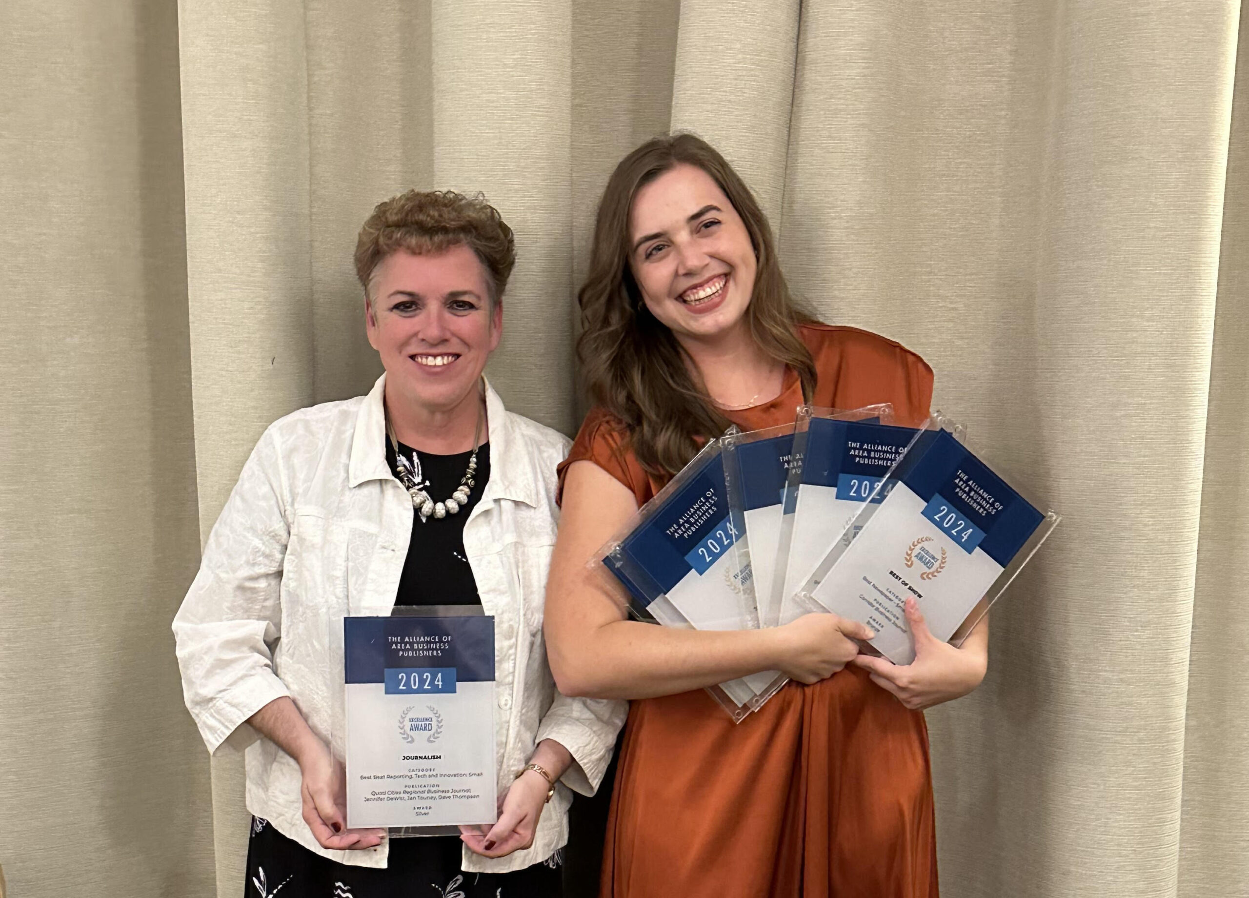 unnamed QCBJ Editor Jennifer DeWitt and CBJ Editor Alexandra Olsen display the Corridor Media Group's AABP 2024 Editorial Excellence Awards.