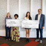 Mali Kituza of Jefferson High School (left) and Amari Rogel of Washington High School (right) pose with their award amounts.