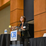 Kanlaya Barr, director of corporate economics at John Deere, speaks at the Corridor Business Journal's Mid-Year Economic Review on July 10. CREDIT ALEXANDRA OLSEN