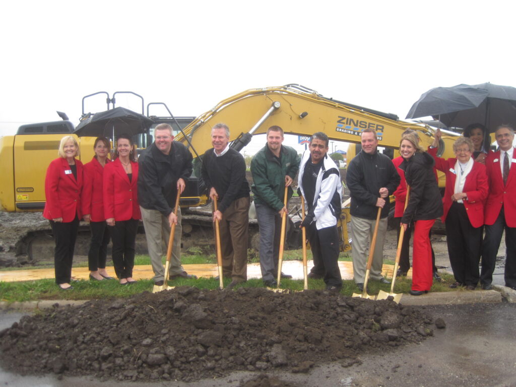 Members of Frew Development’s Westdale Mall redevelopment project team, surrounded by the Cedar Rapids Metro Economic Alliance ambassadors, are pictured during a ceremonial groundbreaking on Sept. 12 for the project.