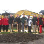 Members of Frew Development’s Westdale Mall redevelopment project team, surrounded by the Cedar Rapids Metro Economic Alliance ambassadors, are pictured during a ceremonial groundbreaking on Sept. 12 for the project.