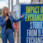 Dawn Wood, director of global learning at Kirkwood Community College, speaks Aug 9 at the opening of the "Impact of Exchange" photo exhibit at the National Czech & Slovak Museum & Library in Cedar Rapids. CREDIT RICHARD PRATT