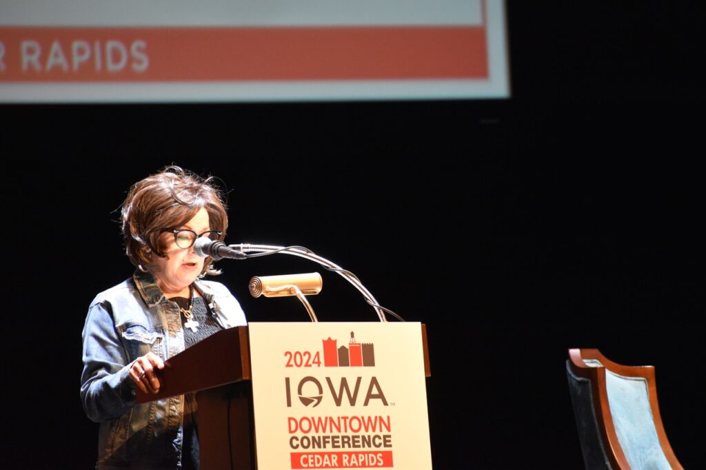 Debi Durham, director of the IEDA and Iowa Finance Authority, speaks at the Paramount Theater Aug. 6 for the IEDA 2024 Iowa Downtown Conference.