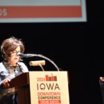 Debi Durham, director of the IEDA and Iowa Finance Authority, speaks at the Paramount Theater Aug. 6 for the IEDA 2024 Iowa Downtown Conference.