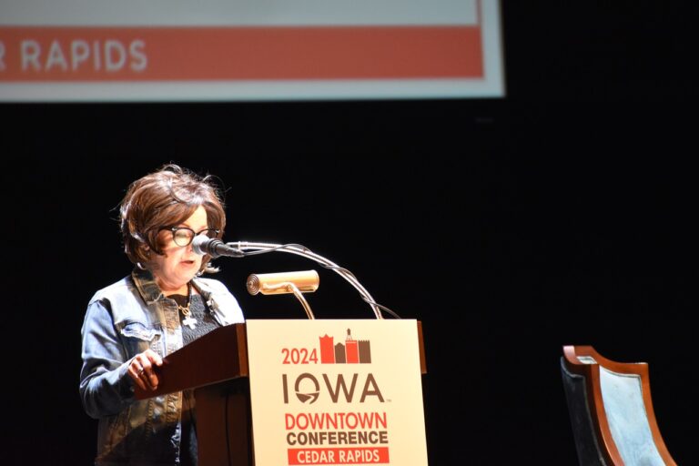 Debi Durham, director of the IEDA and Iowa Finance Authority, speaks at the Paramount Theater Aug. 6 for the IEDA 2024 Iowa Downtown Conference.