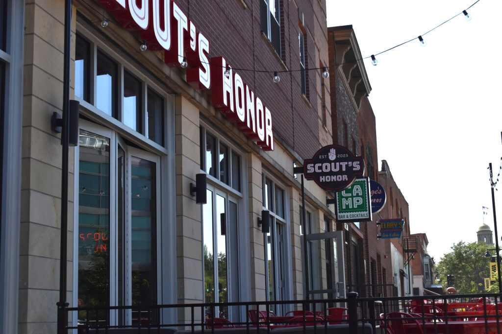 Signs for Scout's Honor and Camp are prominently displayed on Iowa Avenue. Both eateries were recipients of CoSign.
