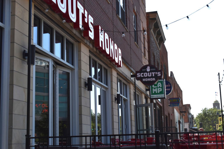 Signs for Scout's Honor and Camp are prominently displayed on Iowa Avenue. Both eateries were recipients of CoSign.