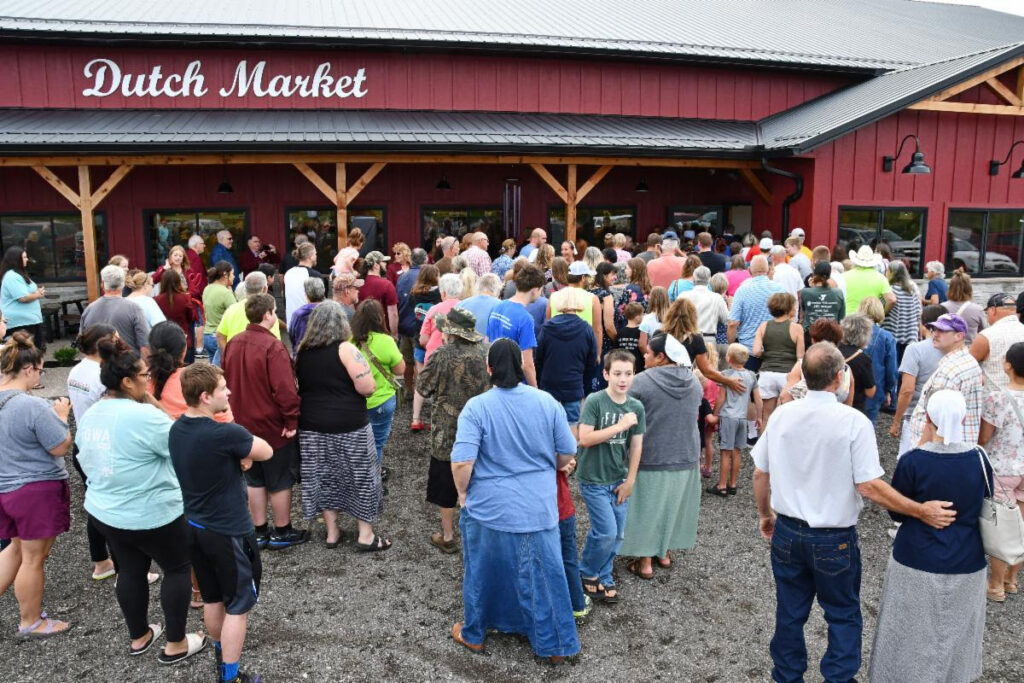 Crowds gather for the grand opening and ribbon-cutting ceremony for Dutch Market in Washington.