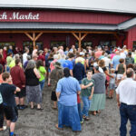 Crowds gather for the grand opening and ribbon-cutting ceremony for Dutch Market in Washington.