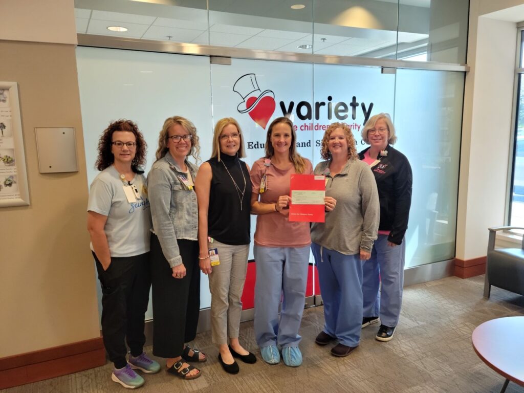 Members of St. Luke's health care team hold a check for $25,000 from Variety–the Children’s Charity.
