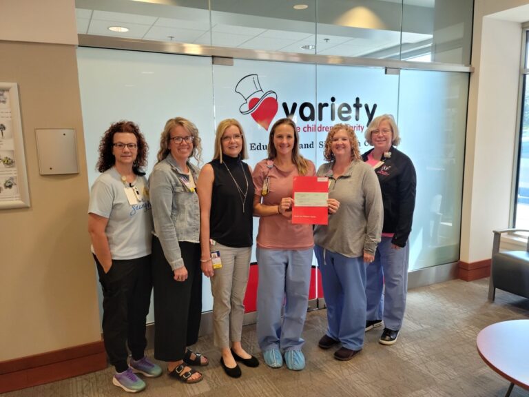 Members of St. Luke's health care team hold a check for $25,000 from Variety–the Children’s Charity.