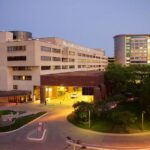 Exterior twilight view of UI Hospitals and Clinics.
