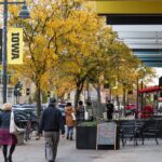 Pedestrians line the sidewalk on E. Iowa Avenue in Iowa City.