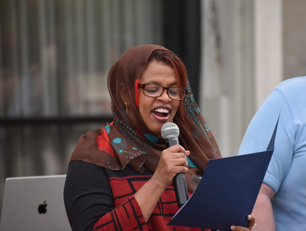 Iowa City Mayor Pro Tem Mazahir Salih reads a proclamation from the city declaring October 2024 National Disability Employment Awareness Month.