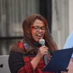 Iowa City Mayor Pro Tem Mazahir Salih reads a proclamation from the city declaring October 2024 National Disability Employment Awareness Month.