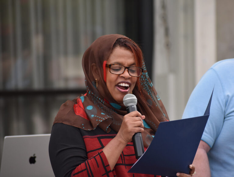 Iowa City Mayor Pro Tem Mazahir Salih reads a proclamation from the city declaring October 2024 National Disability Employment Awareness Month.