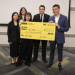Members of the MedBerry team pose with the $1,000 check they received for first place at the Startup games Oct. 5.