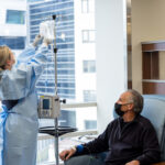 Jessica Stonis, RN MSN, Clinical Practice Leader, with simulated patient in the 4 PFP cancer infusion center on Monday, March 6, 2023.