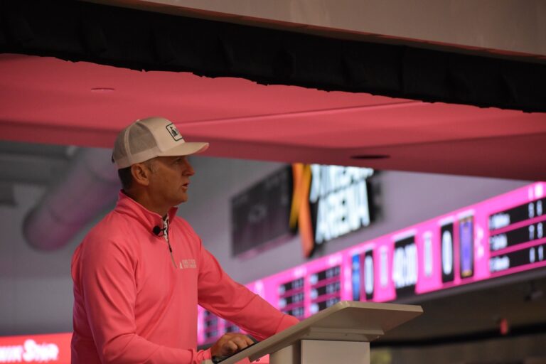 Josh Schamberger, president of the Iowa City Area Sports Commission and Think Iowa City, addresses the crowd in the lobby of the Xtream Arena on Monday, Nov. 4.