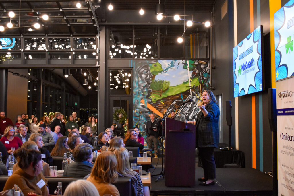 Jaymie McGrath accepts the “Coolest of the Cool” award for McGrath Family of Dealerships during the Coolest Places to Work celebration at Field Day Brewing Dec. 4. CREDIT ANNIE SMITH BARKALOW