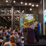 Jaymie McGrath accepts the “Coolest of the Cool” award for McGrath Family of Dealerships during the Coolest Places to Work celebration at Field Day Brewing Dec. 4. CREDIT ANNIE SMITH BARKALOW