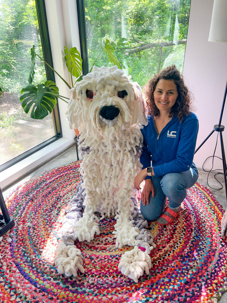 Jessica Bass poses with her unique hand-crocheted creations.