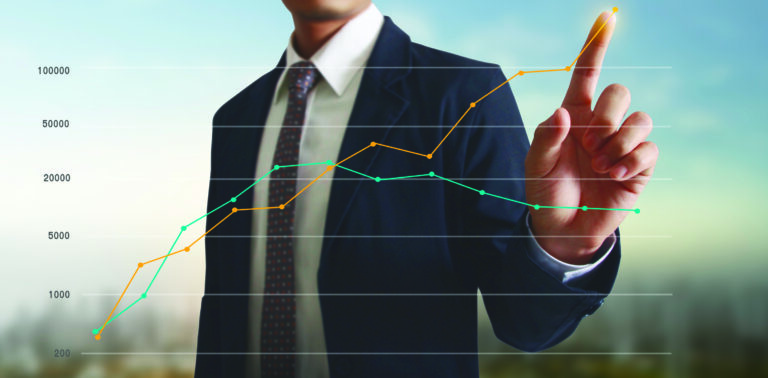 Hand touching a graphs of financial indicator and accounting market