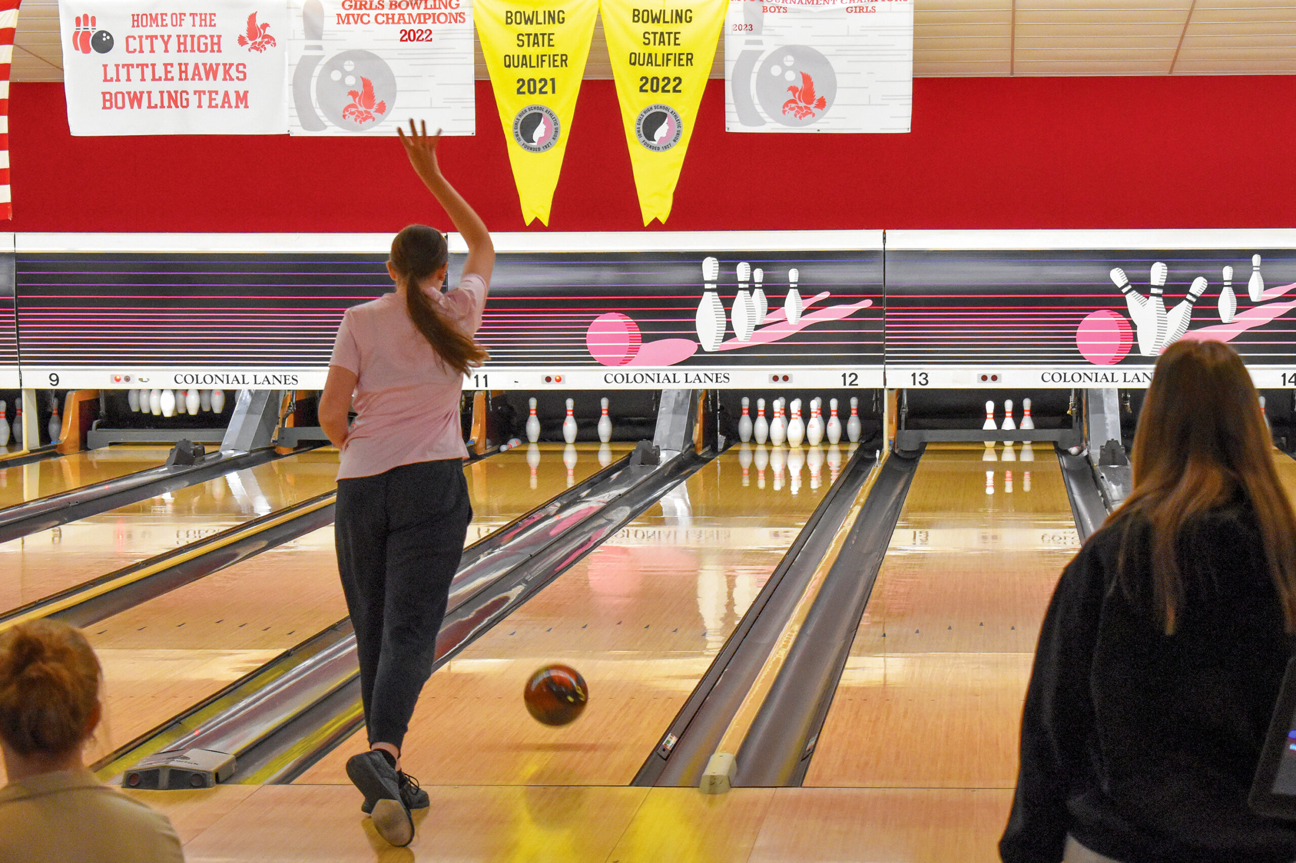 ACB_0104 A Colonial Lanes patron watches the bowling ball she just released glide toward the pins on the bowling lane. Despite renovations going on, business has not slowed down for the bowling center. CREDIT ANNIE SMITH BARKALOW