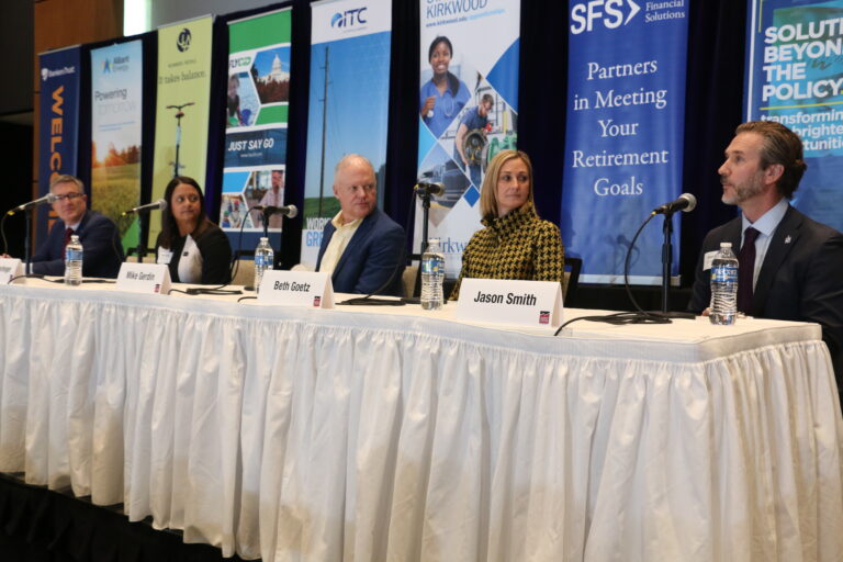 Panelists Brent Cobb, CEO of World Class Industries; May Farlinger, president of Interstate Power & Light Company and vice president of operations for Alliant Energy Corporation; Mike Gerdin, president and CEO of Heartland Express; Beth Goetz, director of athletics at the University of Iowa; and Jason Smith, CEO of TrueNorth Companies pictured at the CBJ's 2025 Economic Forecast Luncheon. CREDIT RICHARD PRATT