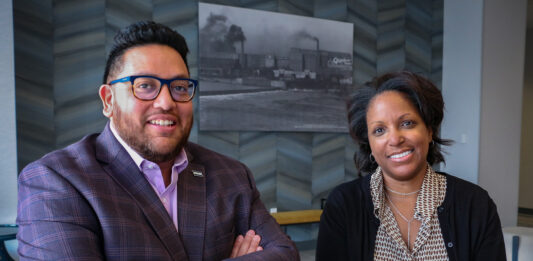 Downtown District executive director Caleb Knutson and program manager Jennifar Bassett are shown at the DoubleTree by Hilton Cedar Rapids Convention Complex in downtown Cedar Rapids. CREDIT RICHARD PRATT