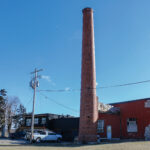 This towering smokestack is the iconic feature of the former Newport’s Flowers building at 2125 Wilson Ave. SW. CREDIT RICHARD PRATT