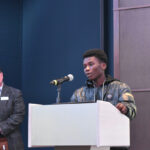 Alouise Francois, a student at Jefferson High School, gives an acceptance speech after receiving the Youth Leader Award at the third annual Catherine McAuley Center Immigration and Business Luncheon March 6.