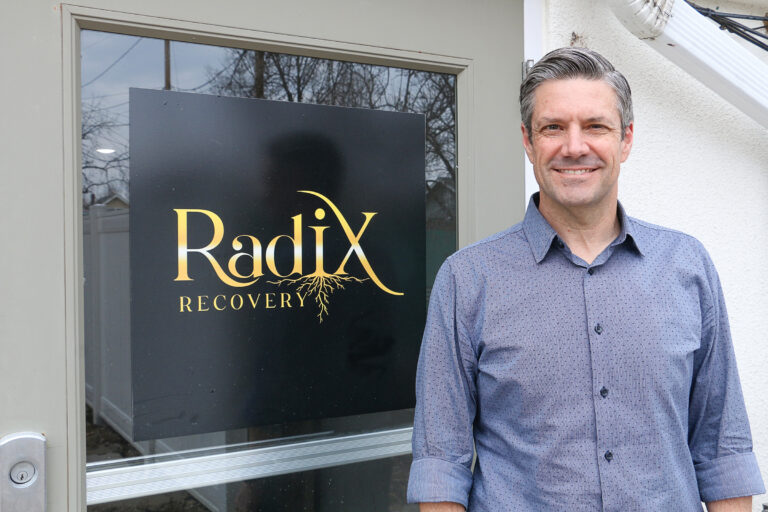 Radix Recovery executive director Jacob Christenson is shown outside the clinic’s outpatient facility at the former Higley Mansion in southeast Cedar Rapids. CREDIT RICHARD PRATT