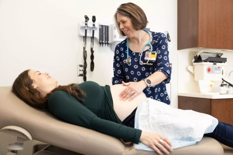 A patient and doctor at UI Health Care's Family Medicine Clinic on Scott Boulevard.