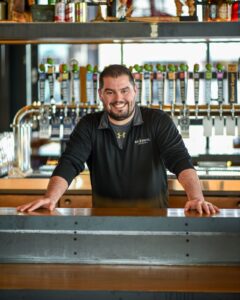 Andrew Mitchell, store director for Big Grove's Cedar Rapids location.
