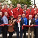Marion Mayor Nick AbouAssaly (center) cuts the ribbon signifying the completion of Marion's Central Plaza project on Wednesday, May 7.
